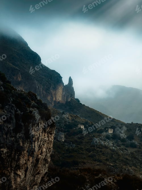 Preview: rocky outcrop sticks out of the fog
