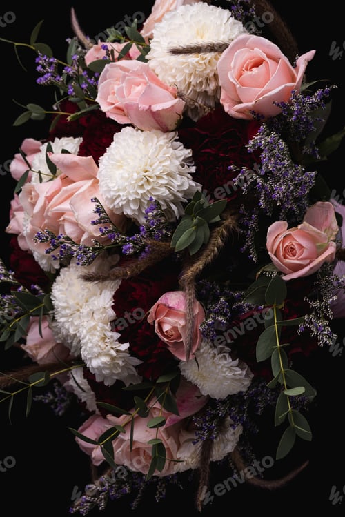 Preview: Vertical closeup shot of a luxurious bouquet of pink roses and white flowers on a black background