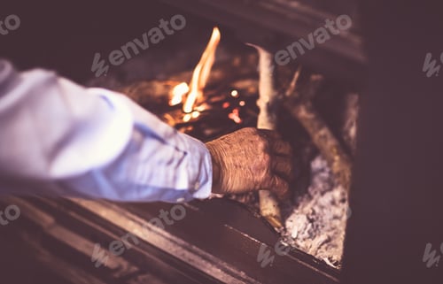 Preview: Man kindle a fire in the fireplace
