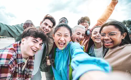 Preview: Multiracial best friends taking selfie picture with smart mobile phone outside