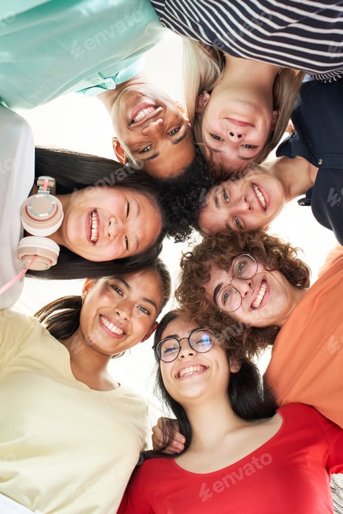 Preview: Vertical photo of a multiracial group of friends taking a selfie