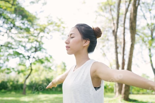 Preview: Young asian woman yoga outdoors keep calm and meditates while practicing yoga.