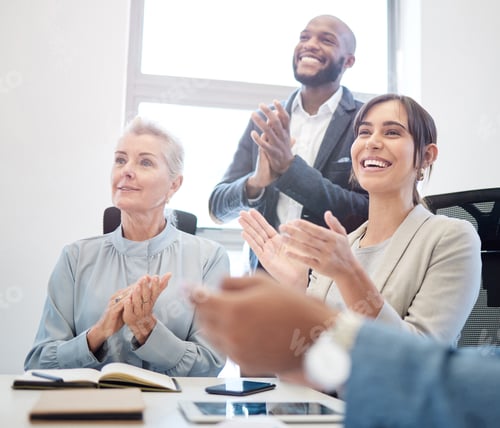 Preview: Shot of a group of businesspeople applauding together in an office