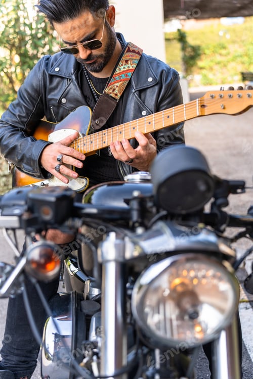 Preview: Man Plays Electric Guitar by Motorcycle Outdoors