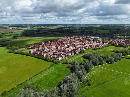 Preview: Drone image of a housing estate in Aylesbury surrounded by green fields and trees