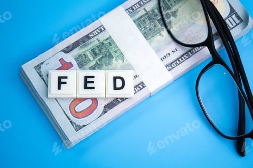 Preview: banknotes with the word FED or The Federal Reserve.