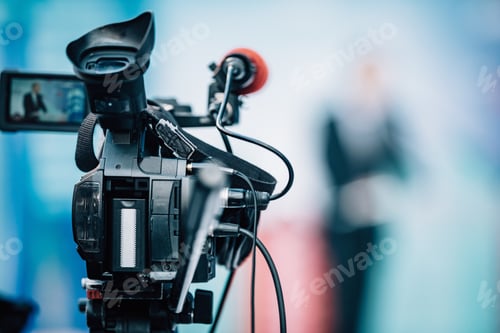 Preview: Camera Recording at a Press Conference.