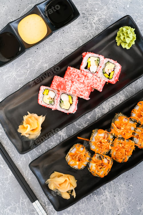 Preview: Set of Rolls with cheese, shrimp, avocado and cucumber, covered with red caviar and baked roll with