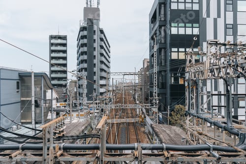 Preview: Dense modern city infrastructure with railway line and power cable in Japan