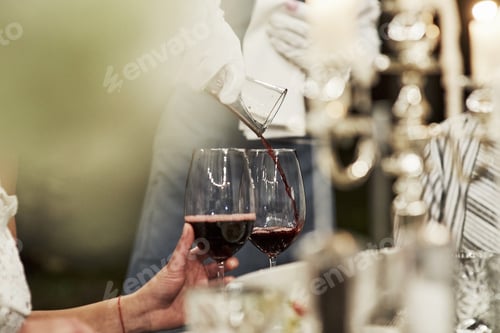 Preview: Outside restaurant at evening time. Pouring wine