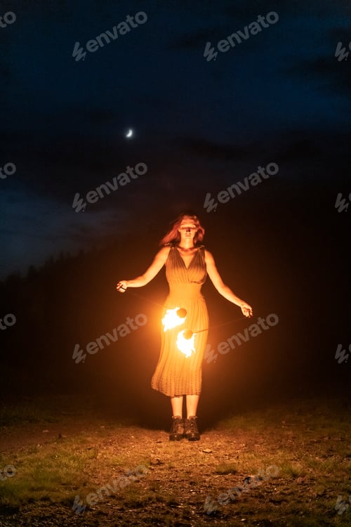 Preview: Graceful elegant red haired female fireshow performer