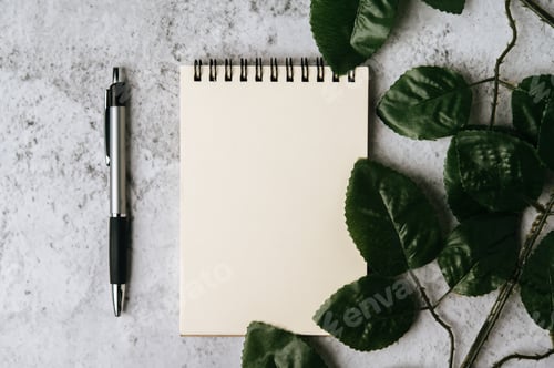 Preview: notebook, pen and leaf is placed on white background