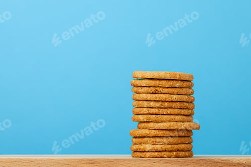 Preview: Stack of round oat cookies on paper background