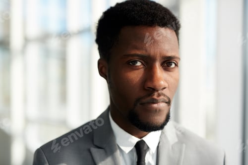 Serious Man in Suit with Neutral Expression