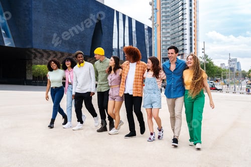 Preview: Happy playful multiethnic group of young friends bonding outdoors