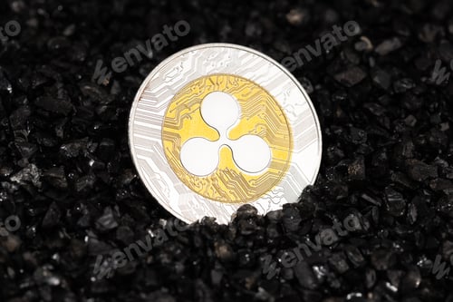 Preview: Ripple XRP coin on black gravel background