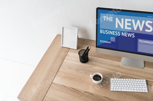 Preview: workplace with computer showing news on screen