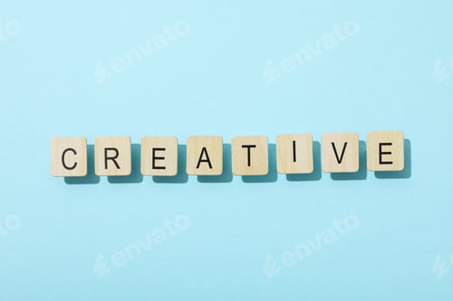 Preview: The word: "creative" laid out in letters on a blue background.