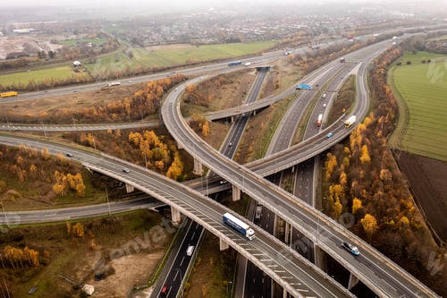 Preview: Aerial view of a complex motorway road layout in the UK countryside