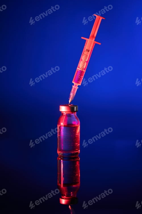 Preview: Red vaccine bottle with injection for coronavirus treatment