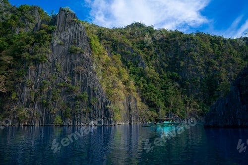 Preview: Traditional Bangka Boat Navigating Deep Blue Waters of Kayangan Lake, Coron