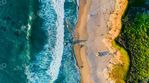 Preview: Aerial view of foamy waves crashing on the sandy Garrapata State Beach in Big Sur, California