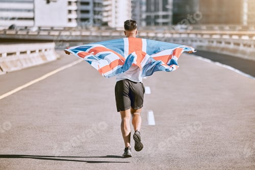 Preview: Winner, flag and fitness man running on the city road celebrates winning achievement in summer. Spo