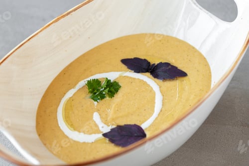 Preview: Vegetable cream soup in bowl on gray table