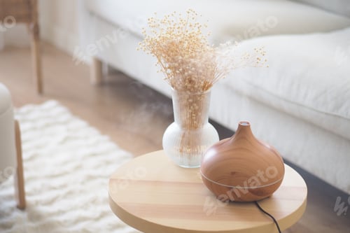 Preview: Home decor with a diffuser and dried flowers on a table