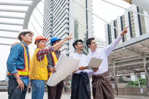 Preview: Businessman meeting with engineer team talking progression report project construction