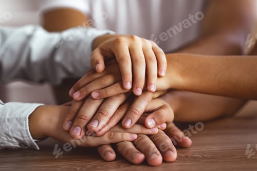 Preview: The three people hold hands together at the table