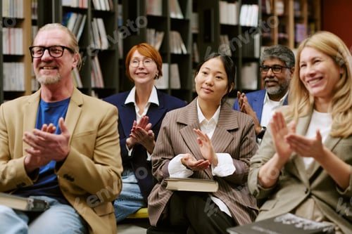 Preview: Multiethnic Group of Adults Applauding after Book Presentation