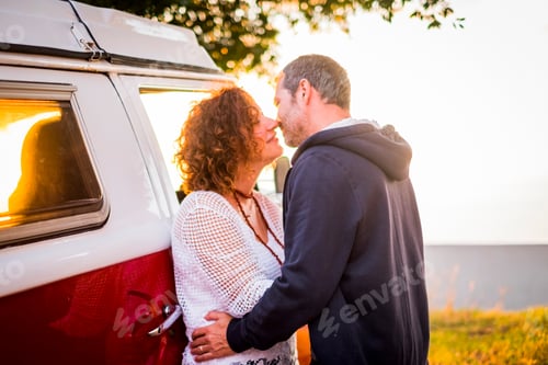 Preview: Couple middle age adult man and woman kissing with love outdoor during travel vacation