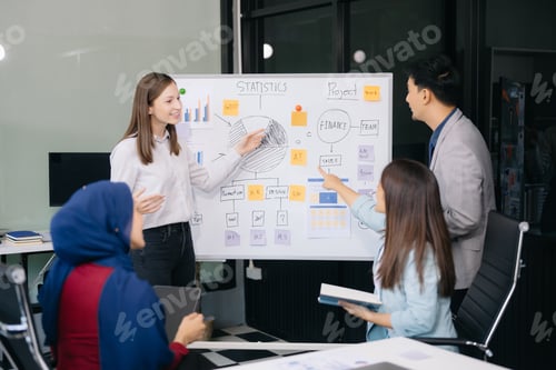 Preview: Creative business people working on business project in office