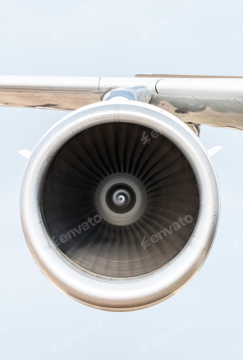 Preview: Jet engine on the airplane wing. Close-up frontal view of the jet engine and sky on the background.
