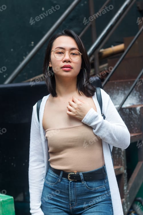 Preview: Young Woman Posing in Jeans and Cardigan