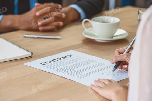 Preview: Closeup Young Asian woman graduate hand signing the contract