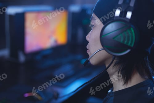 Preview: Asian Gamer Wearing Headset