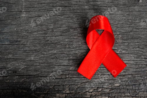 Preview: Red ribbon for world aids day awareness campaign background.
