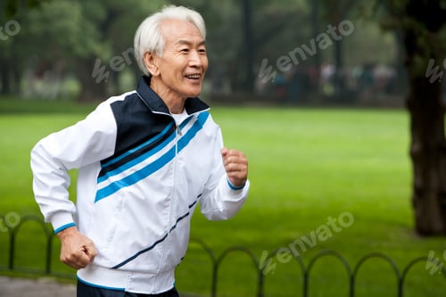 Preview: Senior Chinese man running in a park