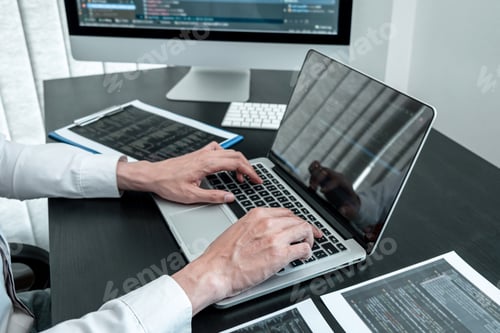 Preview: Programmer working in software javascript computer in IT office, Writing codes and data code