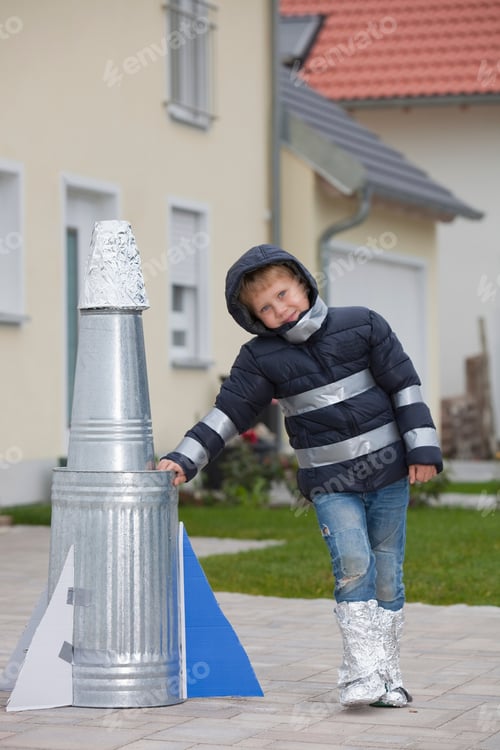Preview: Boy with self-made rocket, happy