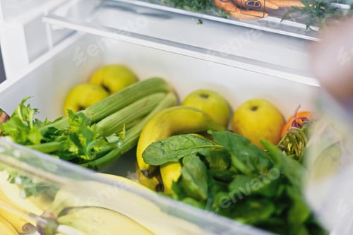 Preview: Zero waste grocery shopping. Fresh vegetables in opened drawer in refrigerator. Vegetarian diet.