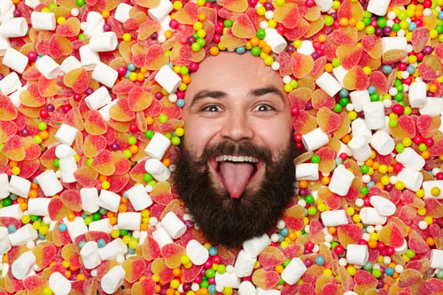 Preview: Man in sweets putting out tongue