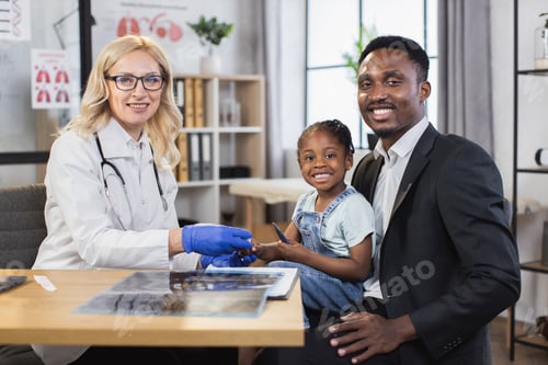Preview: Pediatrician monitoring saturation of cute african girl