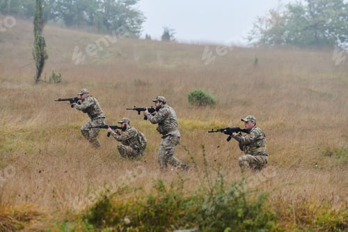 Preview: A disciplined and specialized military unit, donned in camouflage, strategically patrolling and