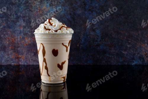 Preview: Vanilla milkshake with chocolate syrup on dark background.