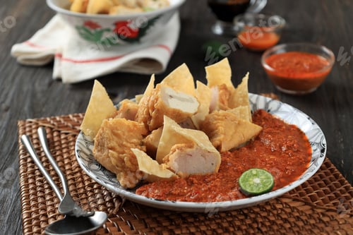 Preview: Close Up A Plate of Batagor or Baso Tahu Goreng with Spicy Peanut Sauce
