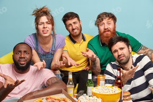 Preview: Annoyed discontent friends irritated with too much television advertising, gesture with apathy, have