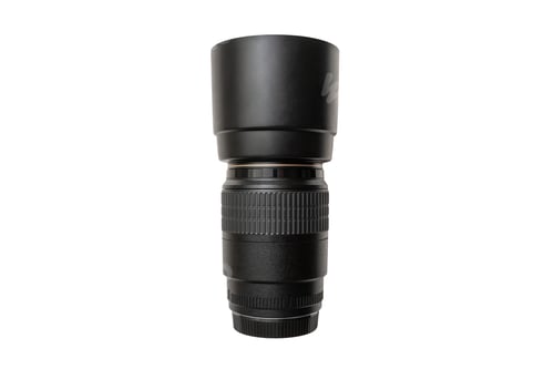 Preview: Closeup of a professional camera lens isolated on a white background
